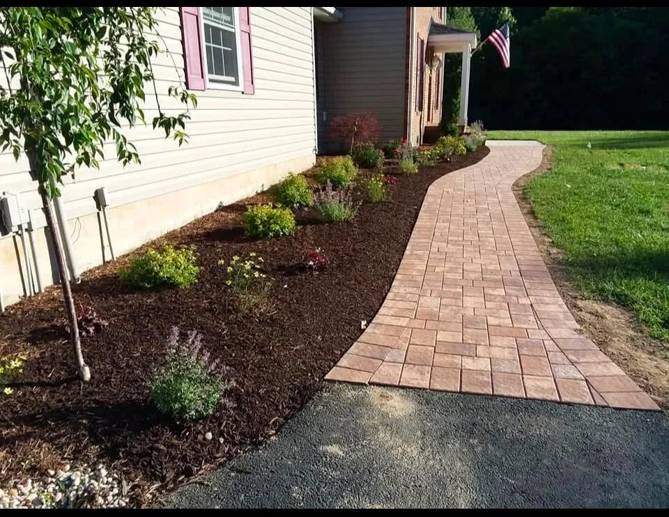Fresh mulch installation on garden beds in Maryland