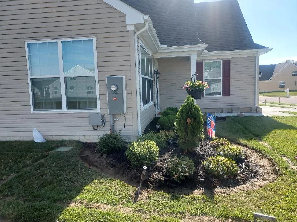 Landscape lighting installation at dusk in Maryland